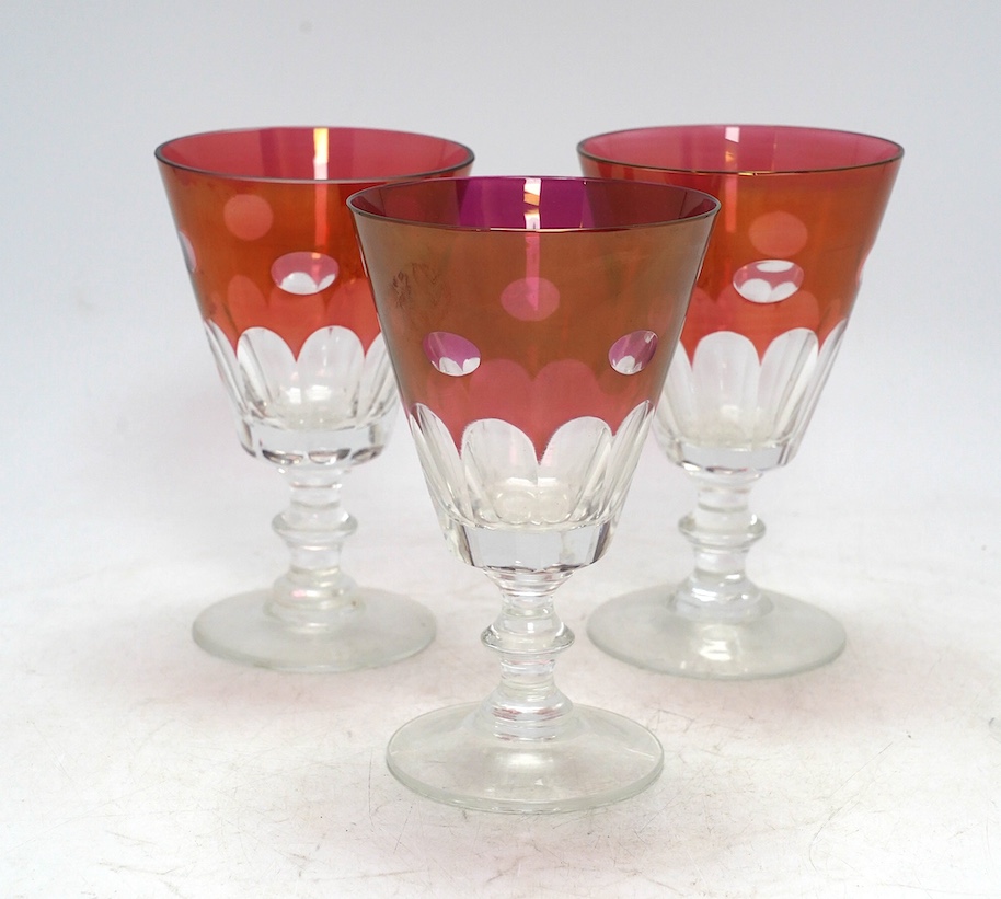 Twelve red lustre cut glass, stemmed wine glasses. 15cm high. Condition - fair to good